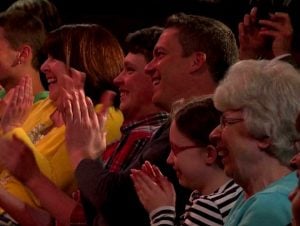 Audience members applauding