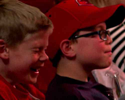 Kids laughing at a magic show